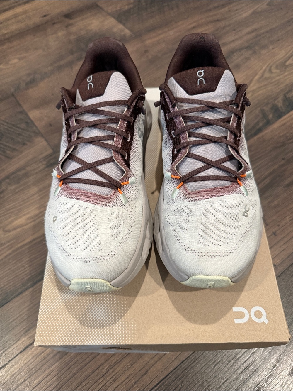 On Running Women’s Neutral White and Brown Athletic Shoes with Orange Accents